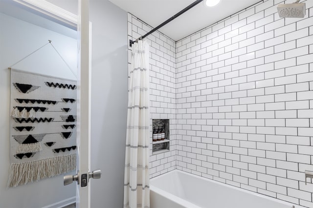 bathroom featuring shower / bath combo with shower curtain