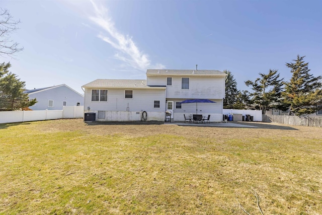 back of property featuring cooling unit, a patio area, a lawn, and a fenced backyard