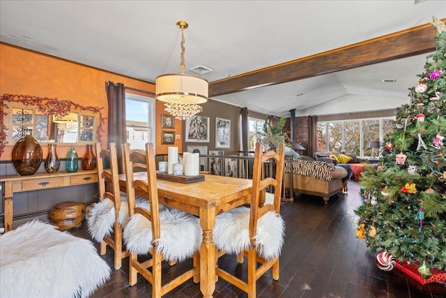 dining room featuring a chandelier, lofted ceiling with beams, dark hardwood / wood-style floors, and plenty of natural light