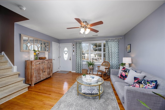 living room featuring ceiling fan and wood-type flooring