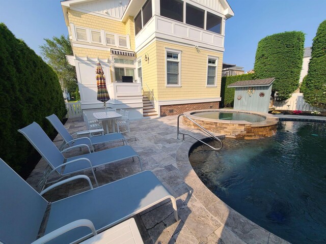 128 30th St, Avalon, NJ 08202 - view of pool with a storage unit, a patio, and a pool with connected hot tub