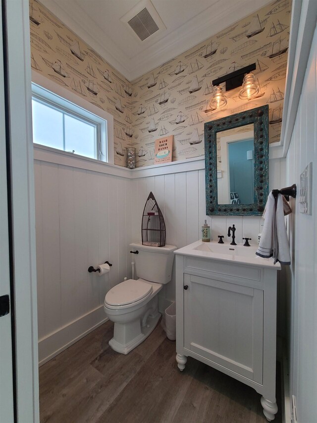 128 30th St, Avalon, NJ 08202 - half bathroom featuring vanity, wood finished floors, a wainscoted wall, and wallpapered walls