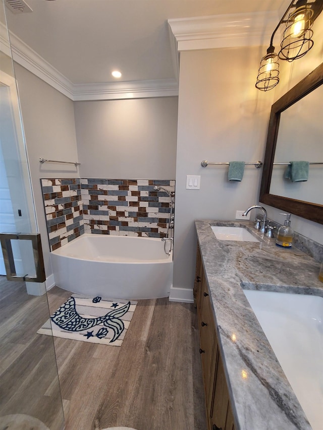 128 30th St, Avalon, NJ 08202 - bathroom with wood finished floors, crown molding, a bath, and double vanity