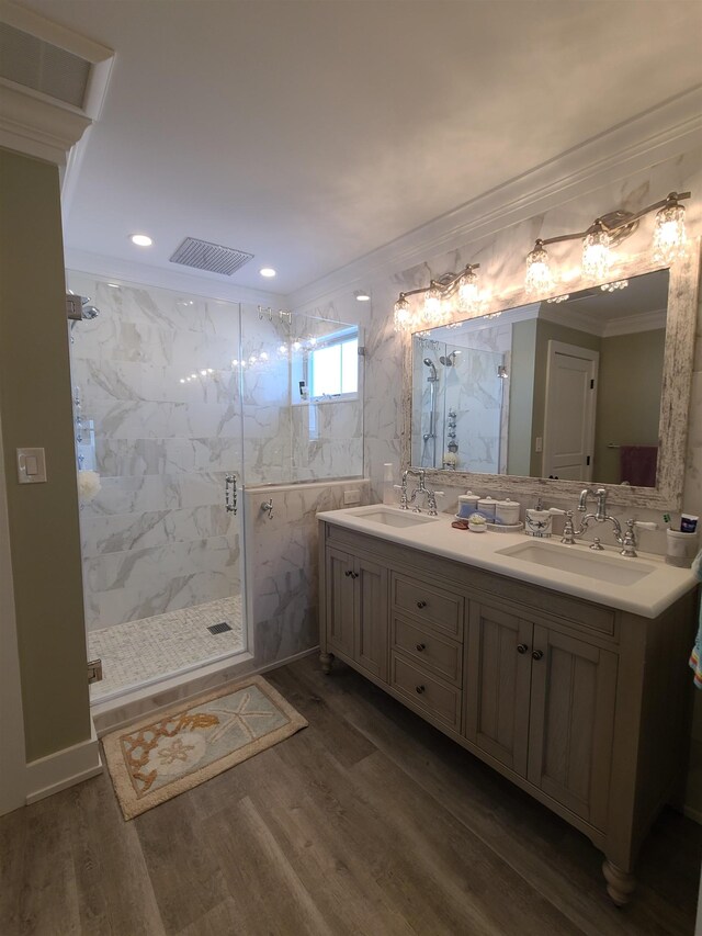 128 30th St, Avalon, NJ 08202 - full bath featuring a marble finish shower, double vanity, crown molding, wood finished floors, and recessed lighting