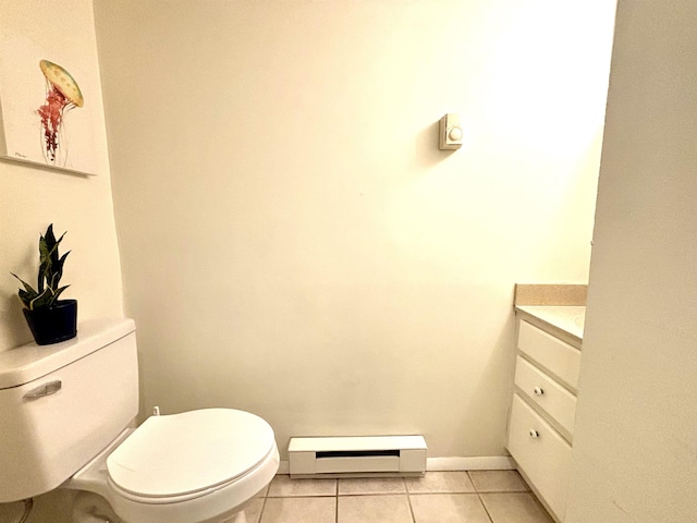 bathroom featuring tile patterned floors, toilet, vanity, and a baseboard heating unit