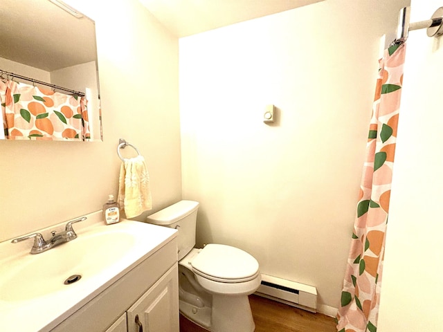 bathroom featuring hardwood / wood-style flooring, vanity, a baseboard radiator, and toilet