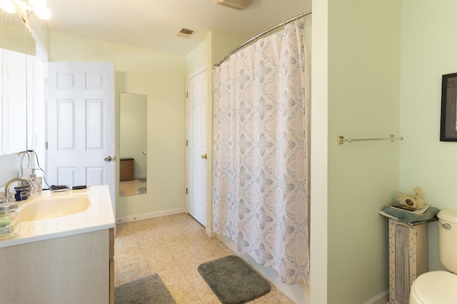 full bath featuring visible vents, baseboards, toilet, and vanity