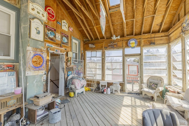 unfurnished sunroom with plenty of natural light and lofted ceiling