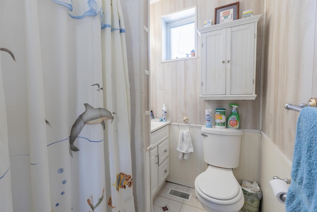 full bathroom with visible vents, toilet, a shower with curtain, tile patterned floors, and vanity