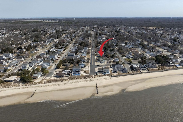 drone / aerial view with a residential view and a water view