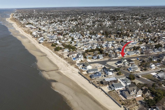 bird's eye view featuring a residential view, a water view, and a view of the beach