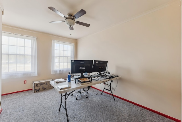 carpeted office space with crown molding, baseboards, and ceiling fan