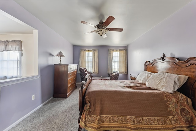 bedroom with carpet, baseboards, and ceiling fan