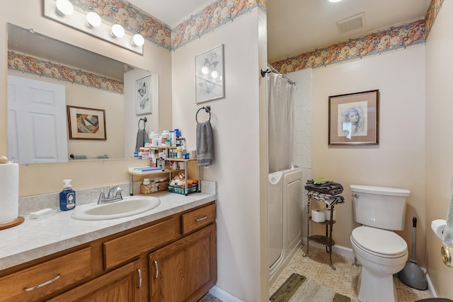 bathroom featuring visible vents, curtained shower, toilet, and vanity