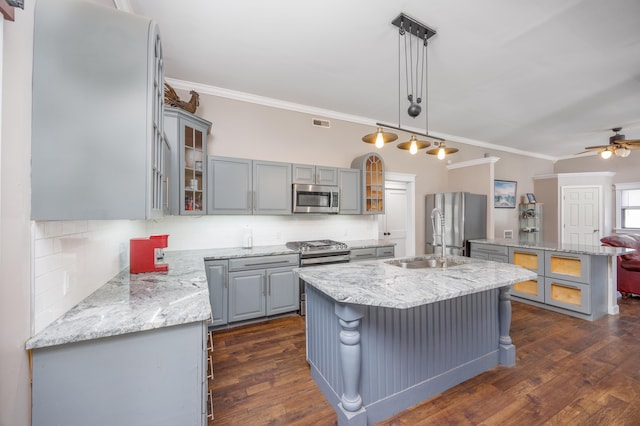 3108 Hemlock Rd, North Cape May, NJ 08204 - kitchen with appliances with stainless steel finishes, gray cabinetry, ornamental molding, a kitchen island with sink, and backsplash