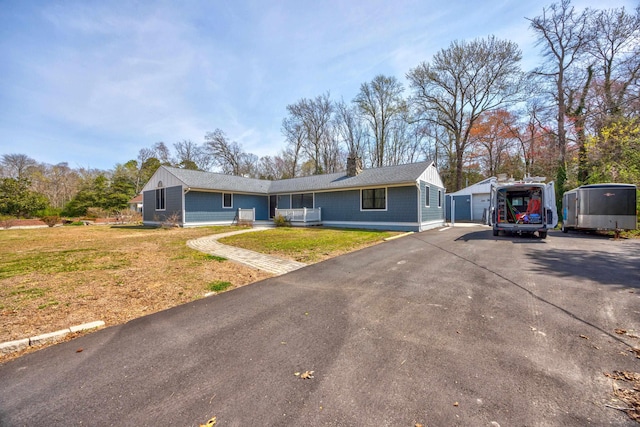 3108 Hemlock Rd, North Cape May, NJ 08204 - ranch-style home featuring a front yard, an outdoor structure, a chimney, and a detached garage