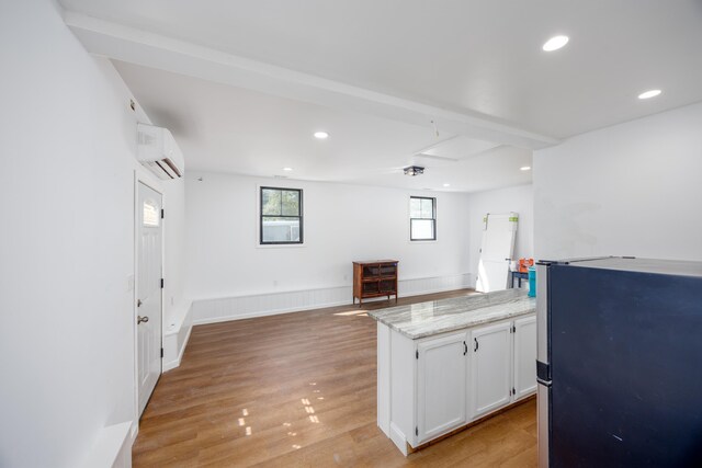 3108 Hemlock Rd, North Cape May, NJ 08204 - kitchen featuring a wall mounted air conditioner, freestanding refrigerator, white cabinets, recessed lighting, and light wood-style floors