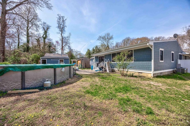 3108 Hemlock Rd, North Cape May, NJ 08204 - view of grassy yard featuring a storage shed and a covered pool