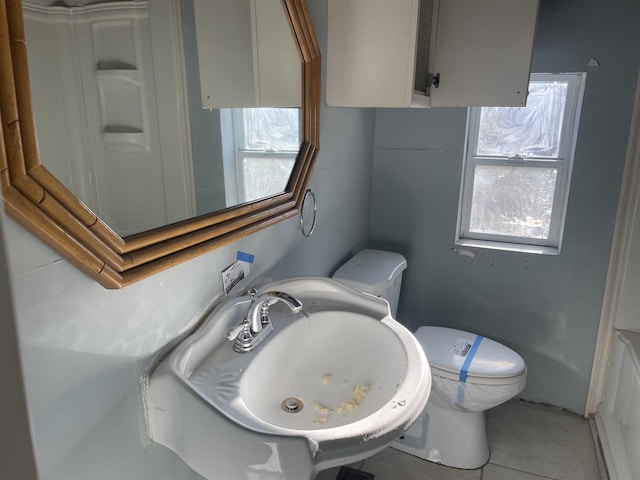 bathroom with sink, tile patterned floors, and toilet