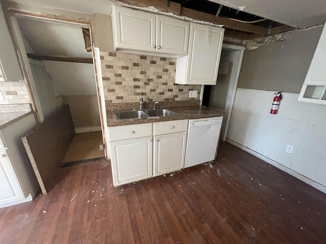 kitchen with sink, white dishwasher, decorative backsplash, and white cabinetry