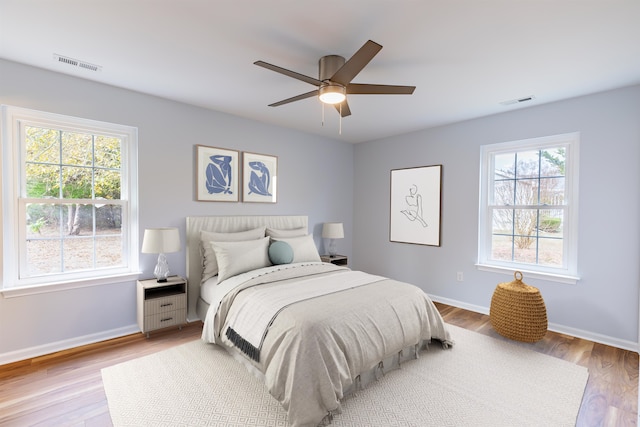 bedroom featuring light wood-type flooring and ceiling fan