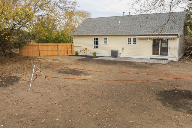 back of house with a patio and central AC unit