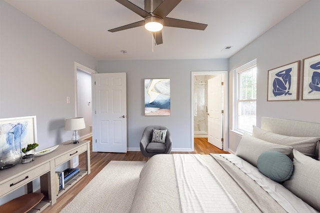 bedroom with ensuite bath, ceiling fan, and wood-type flooring