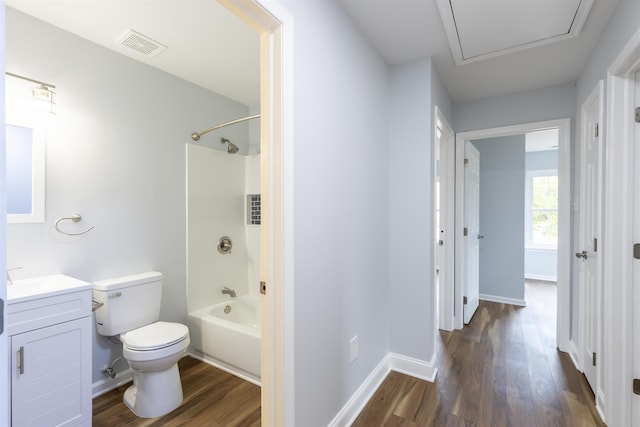 full bathroom with vanity, shower / bathtub combination, toilet, and wood-type flooring