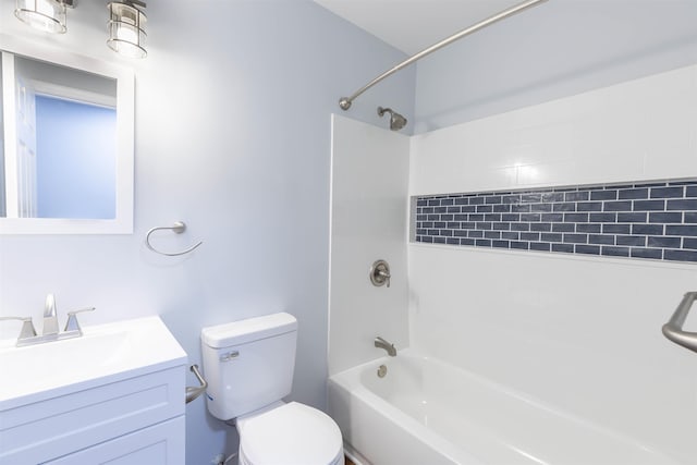 full bathroom featuring vanity, toilet, and tiled shower / bath