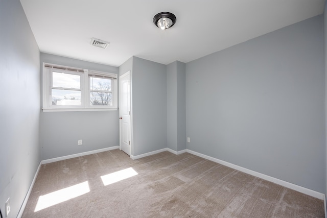 unfurnished bedroom with baseboards, visible vents, and carpet flooring