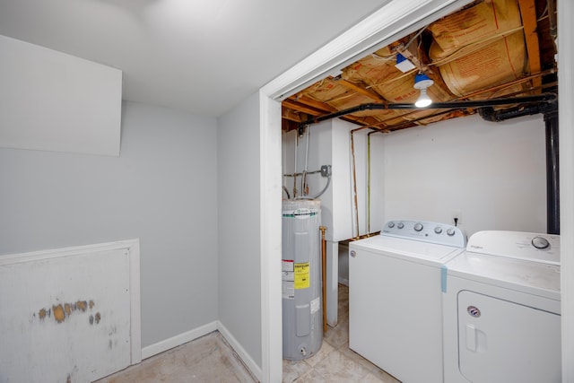 laundry room featuring washer and dryer, laundry area, electric water heater, and baseboards