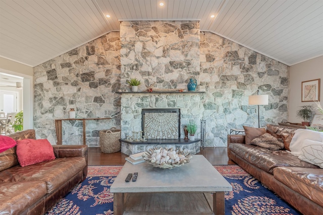 living room featuring wood ceiling, a stone fireplace, dark wood-type flooring, and lofted ceiling