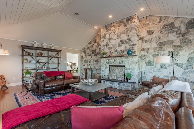 living room with a fireplace, hardwood / wood-style flooring, vaulted ceiling, and wooden ceiling