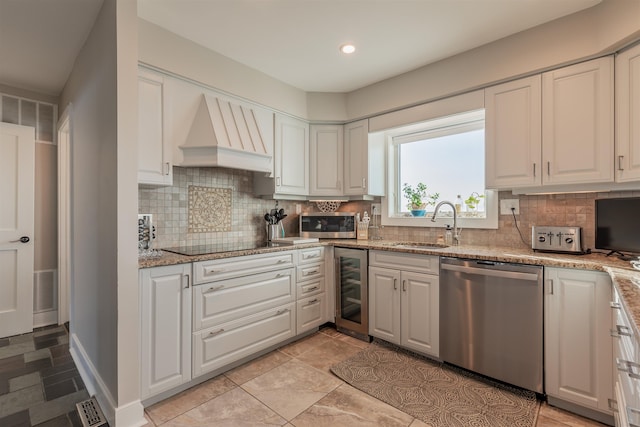 kitchen with white cabinets, sink, stainless steel appliances, and custom exhaust hood