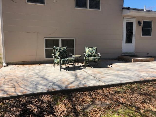 rear view of house with a patio