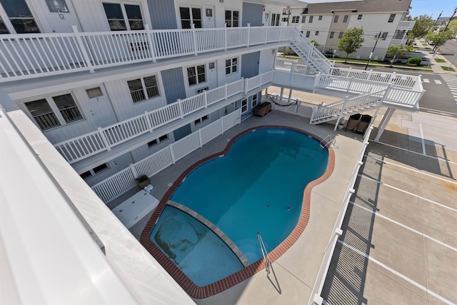 2001 Surf Ave Unit 13, North Wildwood, NJ 08260 - view of swimming pool with a pool with connected hot tub, a patio, and stairs