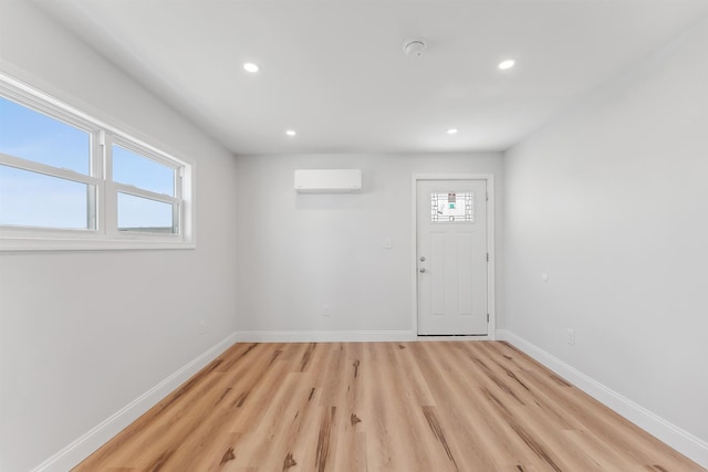 2001 Surf Ave Unit 13, North Wildwood, NJ 08260 - foyer entrance with a wall mounted air conditioner, baseboards, recessed lighting, and light wood-style flooring
