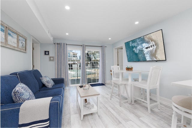 living room with light hardwood / wood-style flooring