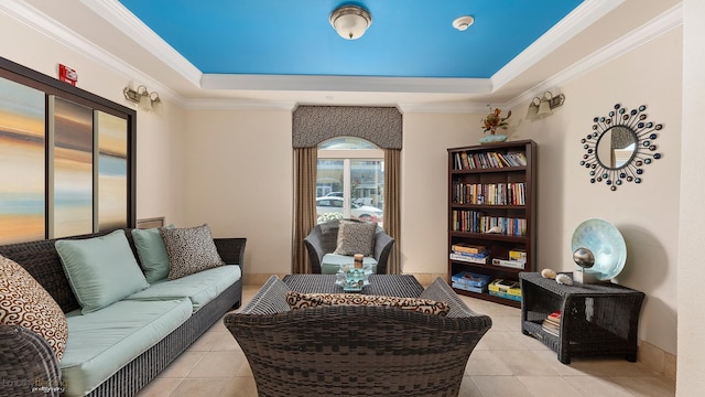 living room featuring crown molding, a tray ceiling, and light tile patterned flooring