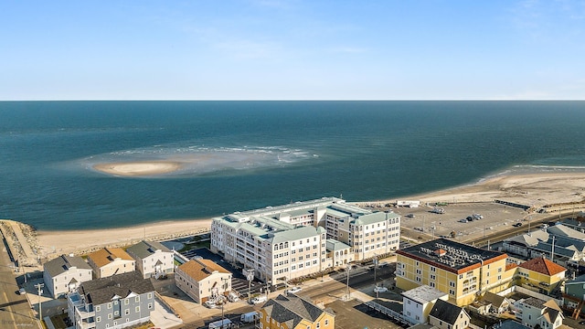 aerial view featuring a water view and a beach view