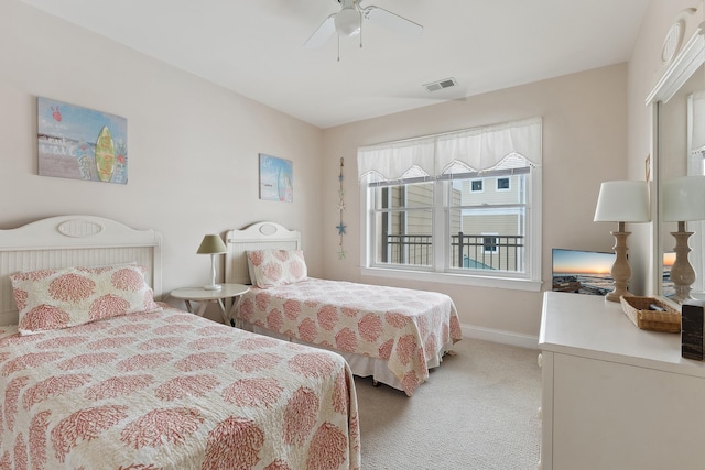 bedroom with ceiling fan and carpet