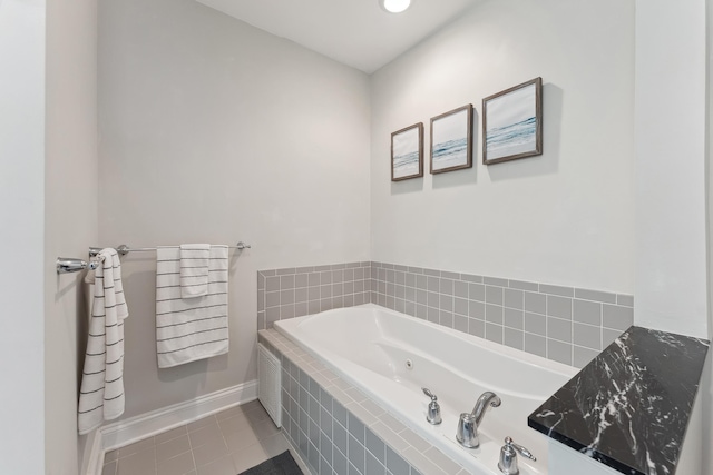 bathroom featuring tiled tub and tile patterned floors