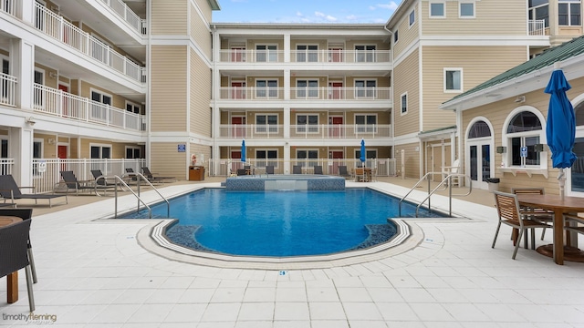 view of swimming pool with a patio area