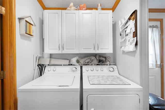 laundry room featuring washer and clothes dryer and cabinet space