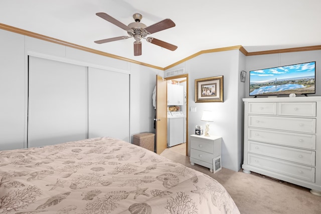 bedroom with light colored carpet, washer / dryer, visible vents, ornamental molding, and a closet