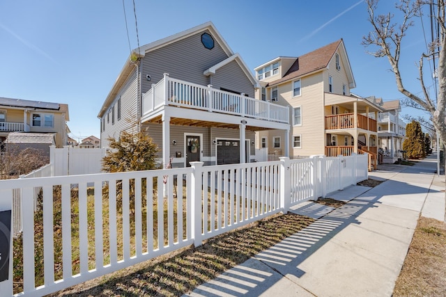 view of front facade featuring a fenced front yard and a residential view