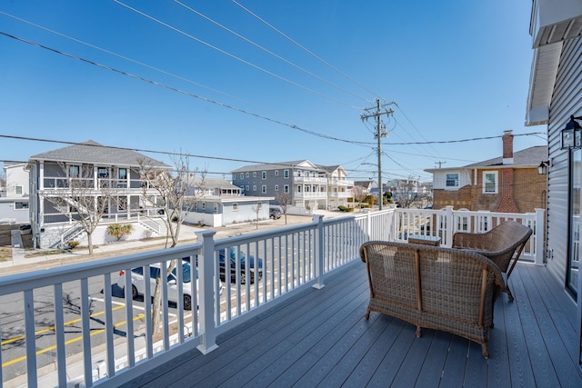 wooden deck featuring a residential view