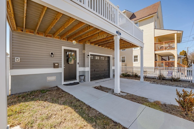 doorway to property with driveway and fence