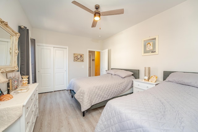 bedroom with a ceiling fan, a closet, and light wood-style flooring