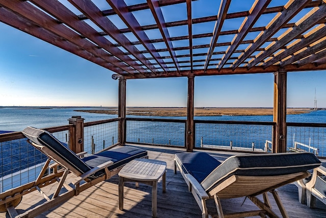 dock area featuring a water view and a pergola